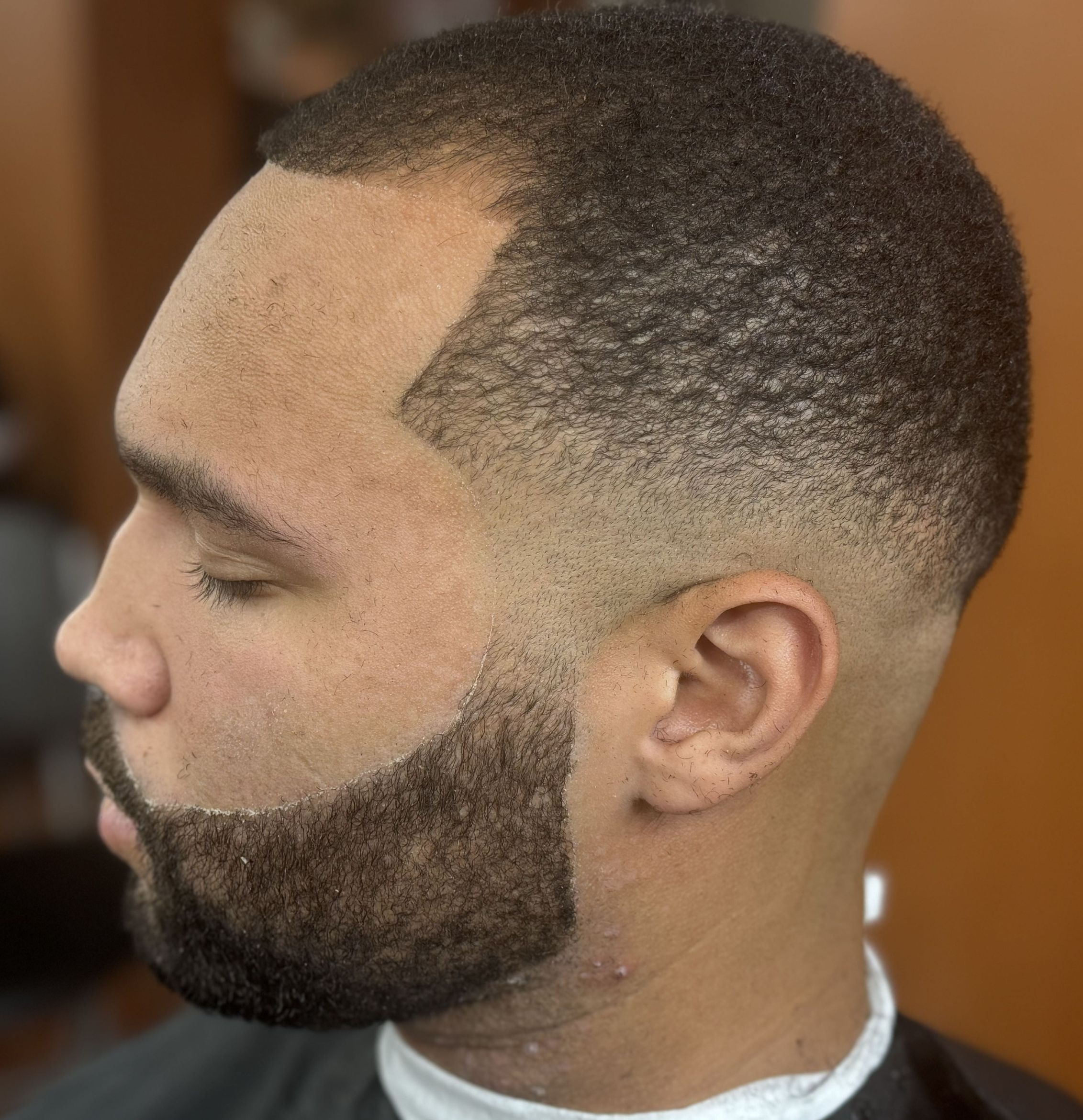 Drop fade with sculpted beard by Big Shawn — Rocky's Primetime Barbershop Atlanta