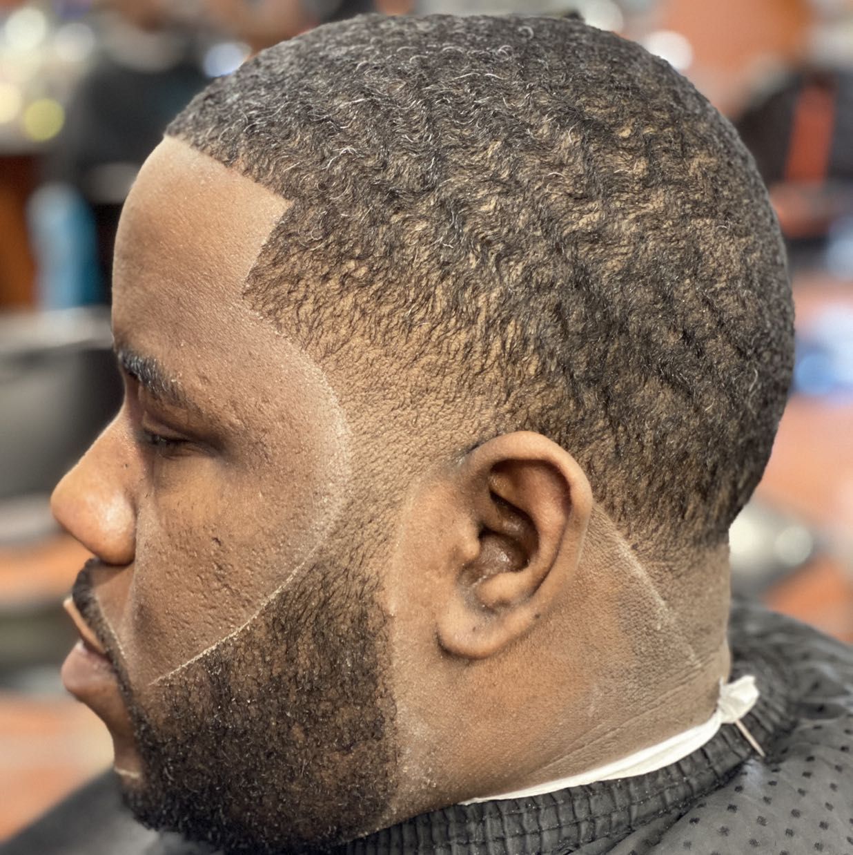 Drop fade with sharp beard line by Quan — Rocky's Primetime Barbershop Atlanta