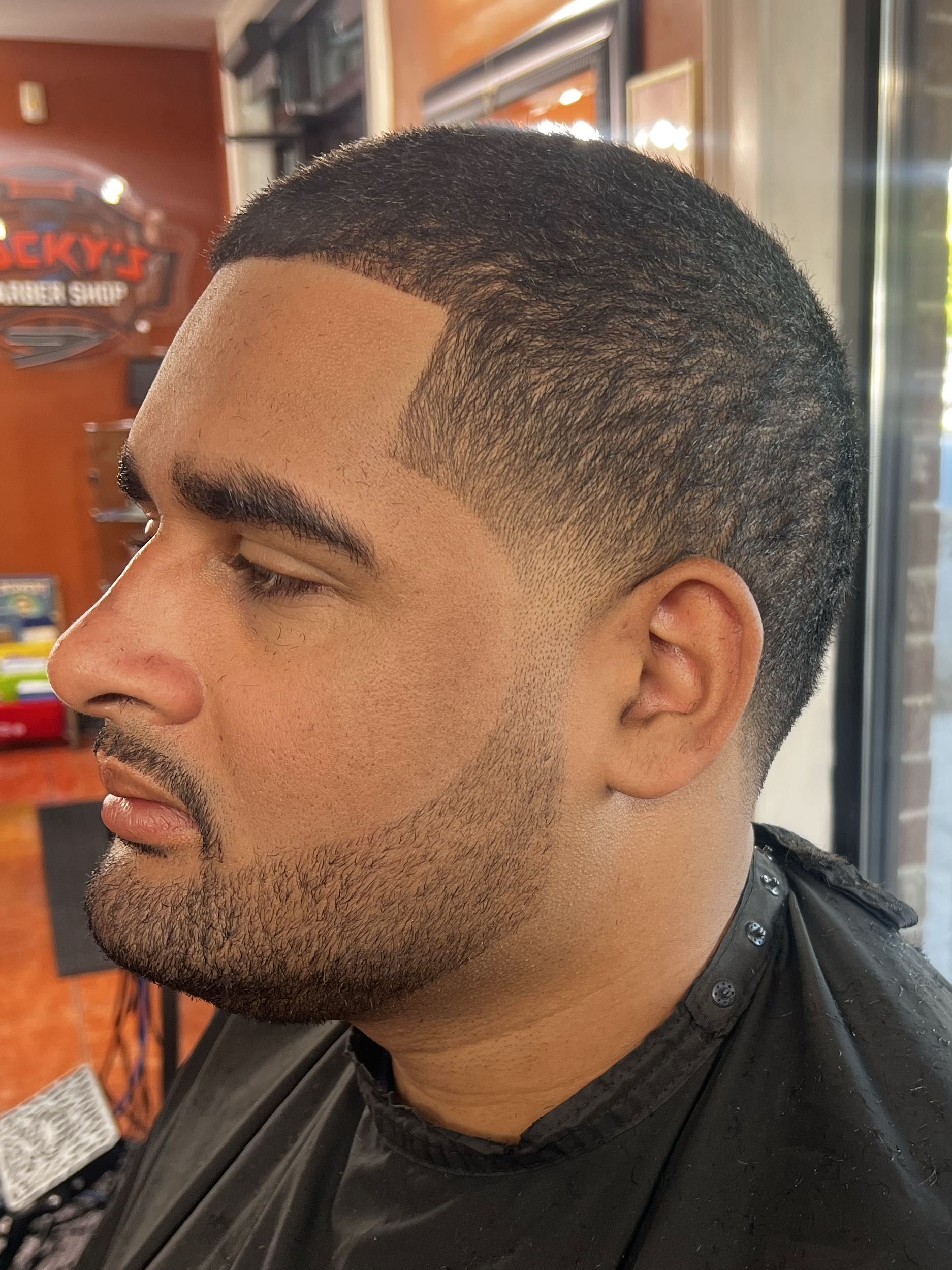 Low fade with crisp lineup and beard by Rich — Rocky's Primetime Barbershop Atlanta