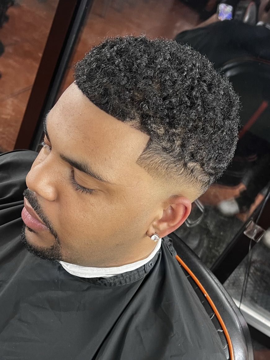 Curly top with drop fade by Rich — Rocky's Primetime Barbershop Atlanta