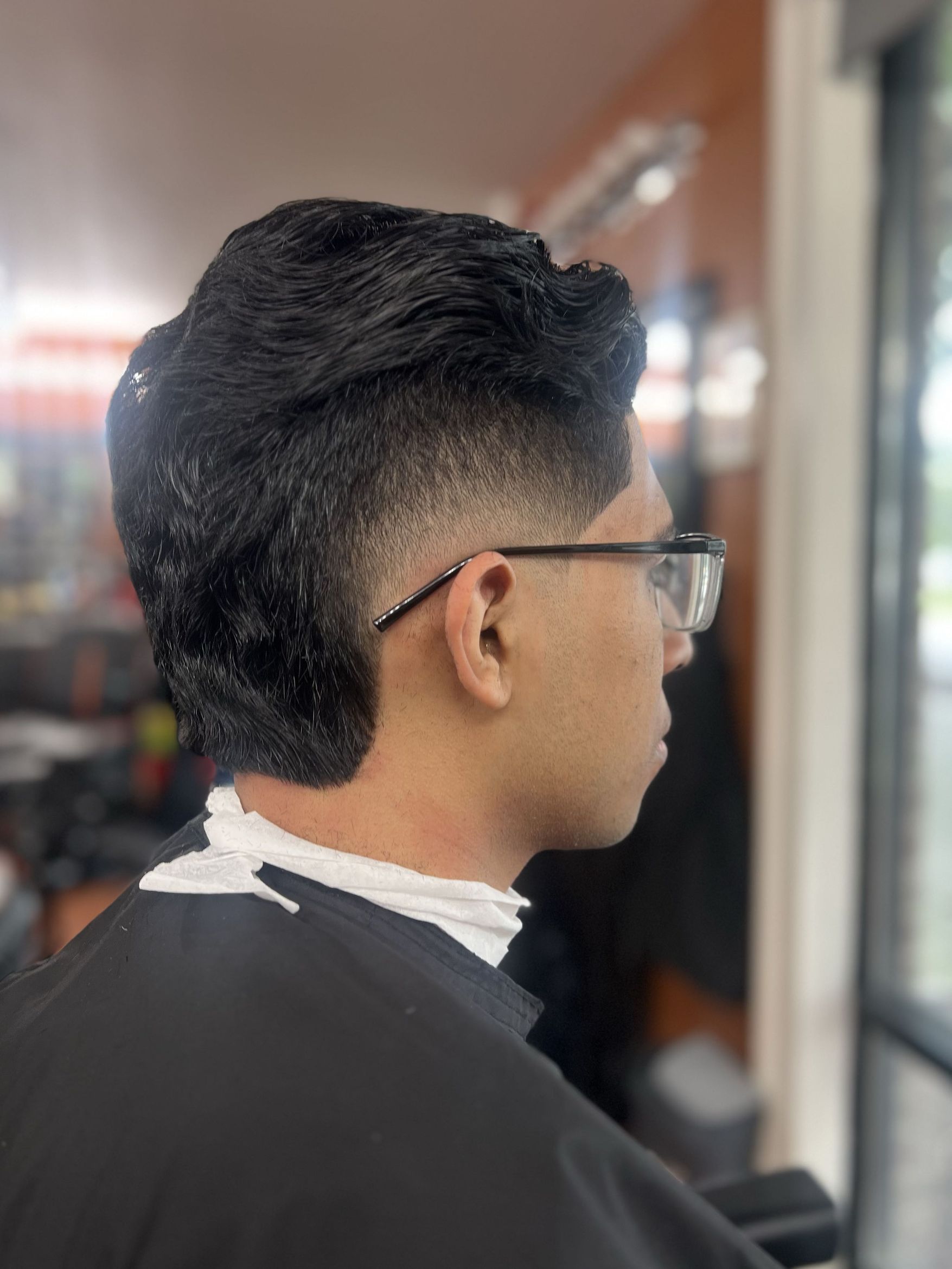 Modern wavy mullet with drop fade by Rich — Rocky's Primetime Barbershop Atlanta